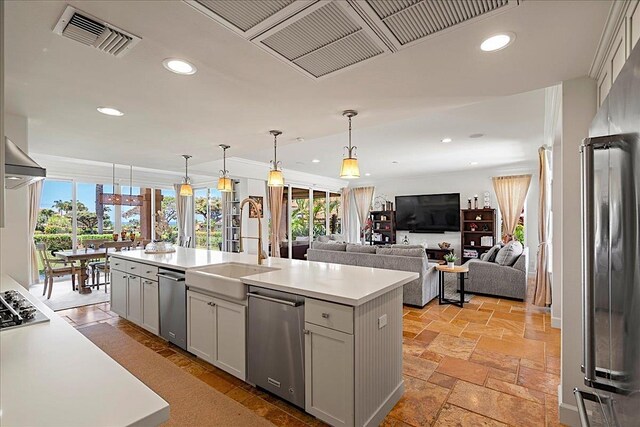 357 Umeke St Unit 144, Kihei, HI 96753 - kitchen featuring light countertops, recessed lighting, a wealth of natural light, visible vents, and a center island with sink