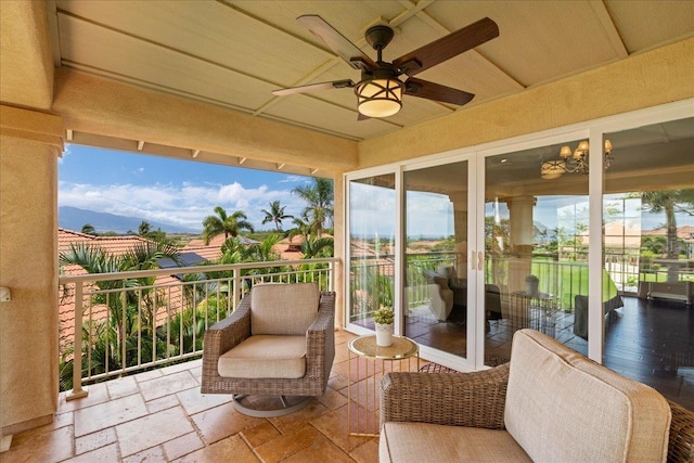 357 Umeke St Unit 144, Kihei, HI 96753 - sunroom featuring a ceiling fan and stone tile flooring