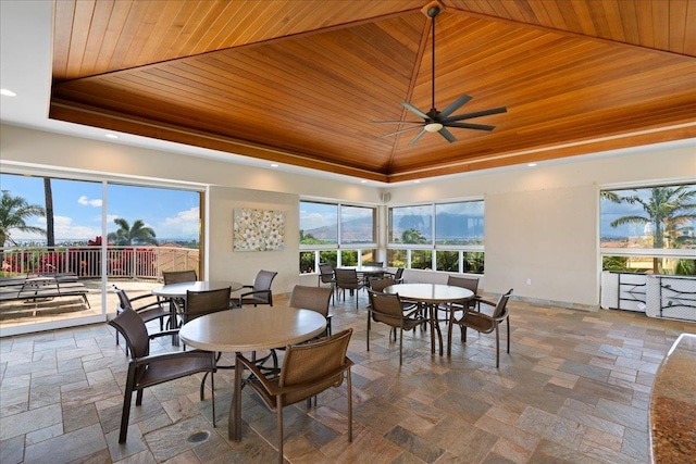 357 Umeke St Unit 144, Kihei, HI 96753 - dining room with plenty of natural light, a raised ceiling, ceiling fan, and wooden ceiling