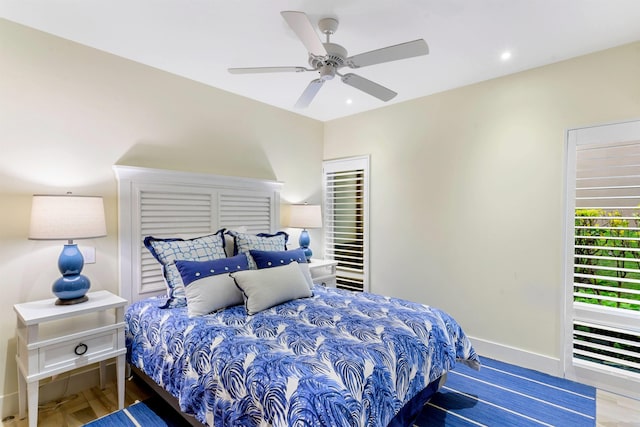 bedroom featuring ceiling fan and wood-type flooring