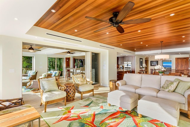 living room featuring ceiling fan, light hardwood / wood-style floors, and wood ceiling