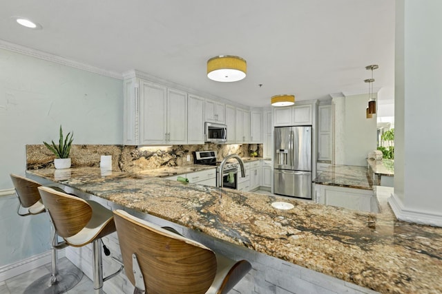 kitchen with stainless steel appliances, a peninsula, light stone counters, and tasteful backsplash