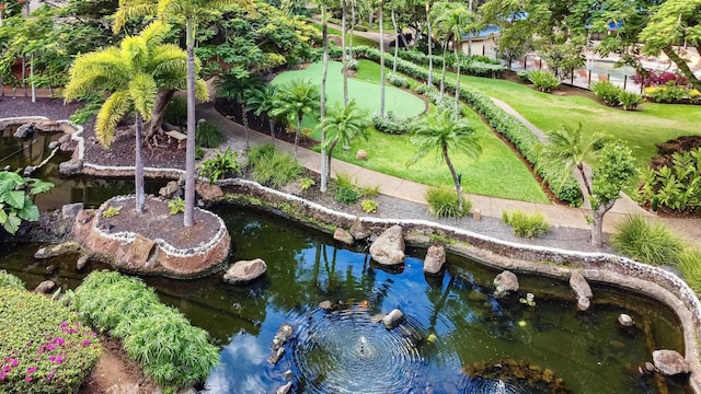 aerial view featuring a garden pond