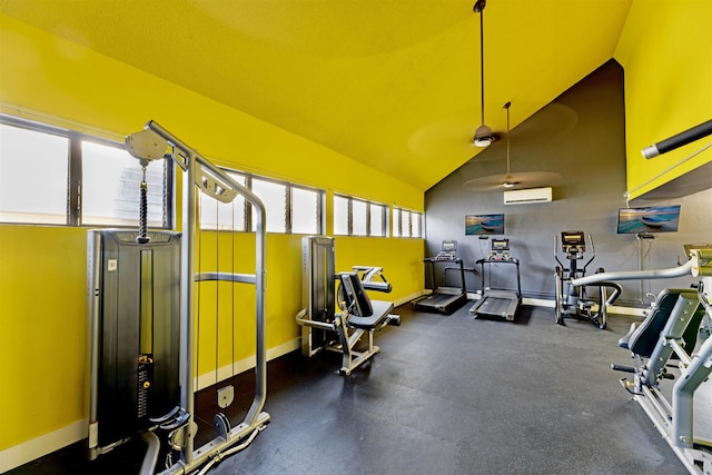 exercise room featuring lofted ceiling, a ceiling fan, baseboards, and a wall mounted air conditioner