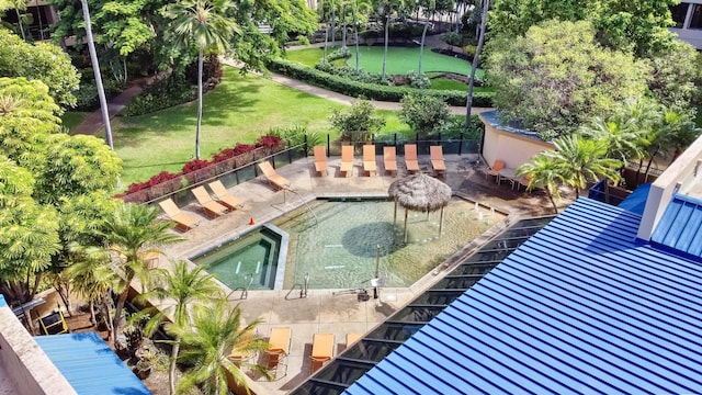 view of swimming pool featuring a yard and a patio
