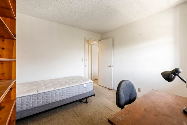 140 Uwapo Rd Unit 18-203, Kihei, HI 96753 - bedroom with light carpet and a textured ceiling