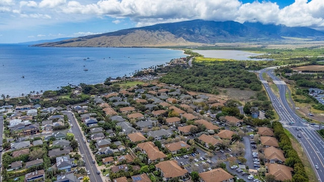 140 Uwapo Rd Unit 18-203, Kihei, HI 96753 - aerial view of property and surrounding area with a water and mountain view and nearby suburban area