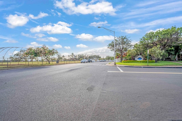 140 Uwapo Rd Unit 18-203, Kihei, HI 96753 - view of asphalt road with street lighting