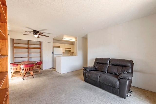 140 Uwapo Rd Unit 18-203, Kihei, HI 96753 - living room featuring light carpet and a ceiling fan