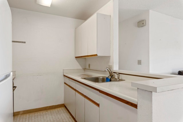140 Uwapo Rd Unit 18-203, Kihei, HI 96753 - kitchen with light countertops, white cabinets, and refrigerator