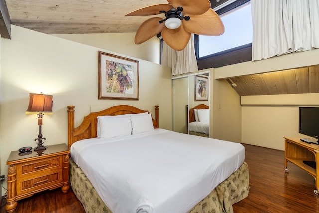 bedroom with lofted ceiling, wood ceiling, dark hardwood / wood-style flooring, and ceiling fan