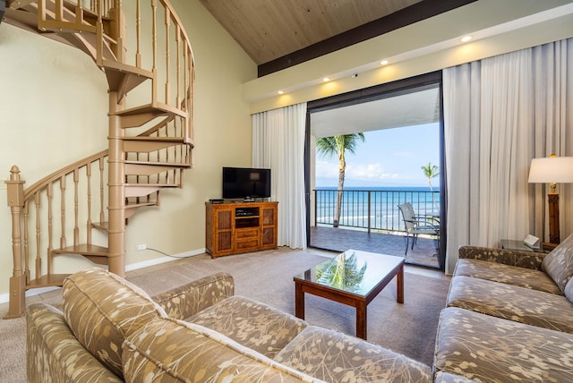 living room featuring a high ceiling, wood ceiling, and carpet