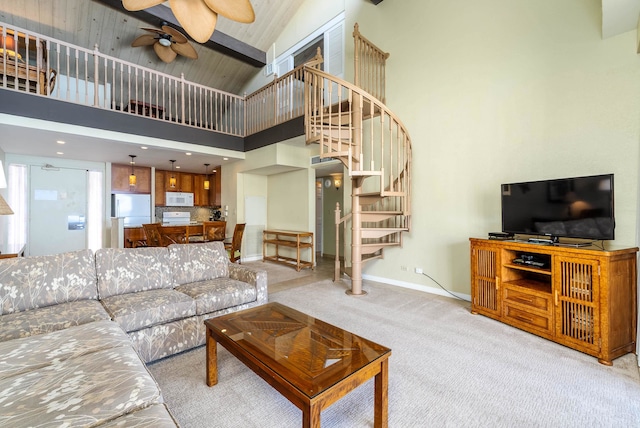 living room featuring high vaulted ceiling, ceiling fan, and light colored carpet