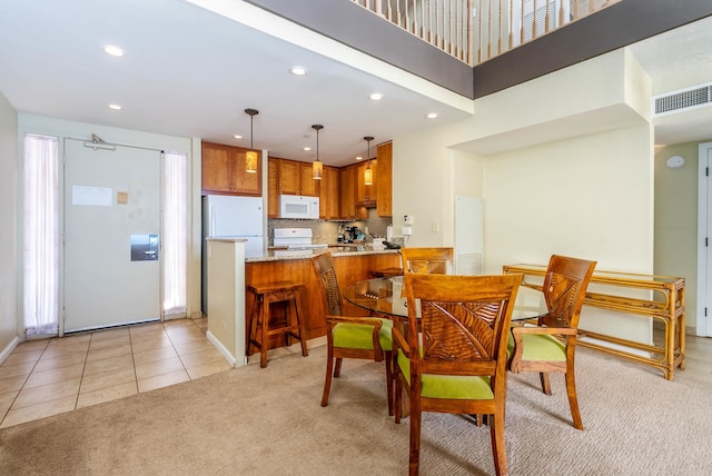 dining space with light tile patterned floors