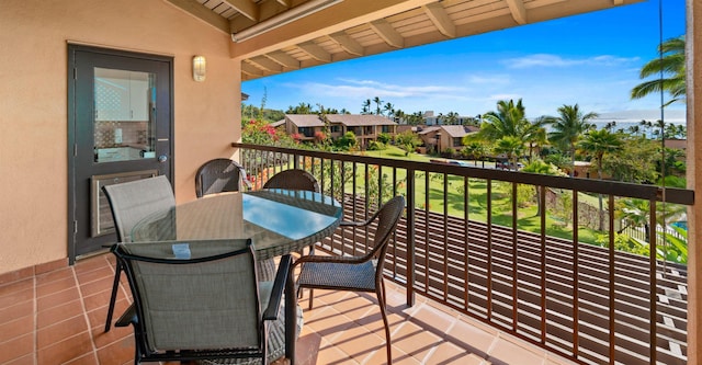 balcony featuring a residential view and outdoor dining area