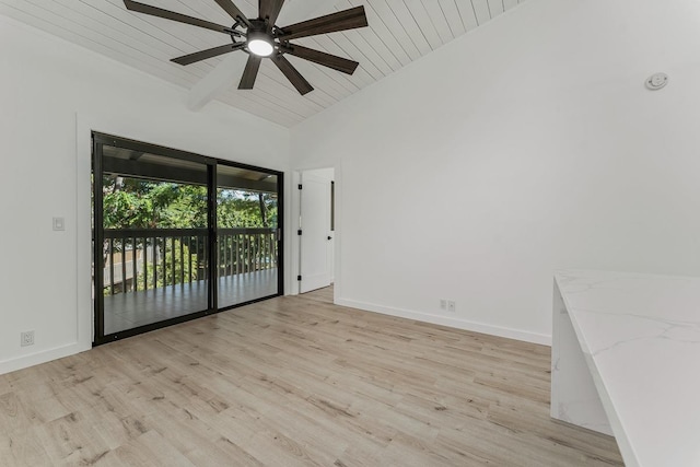 empty room featuring wooden ceiling, baseboards, light wood-style floors, and lofted ceiling