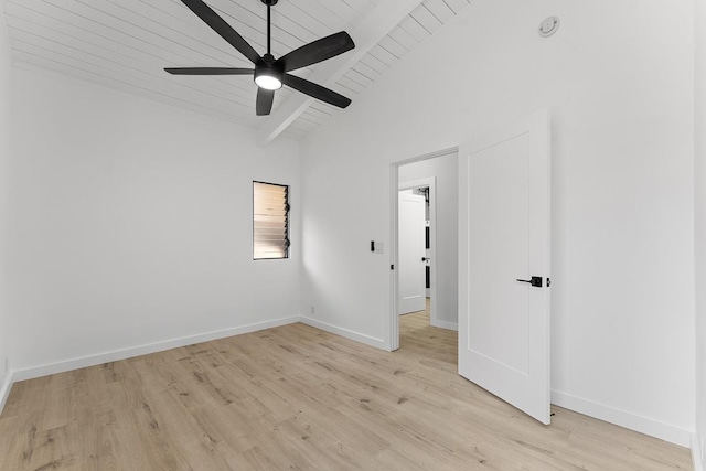 unfurnished room with light wood-style flooring, a ceiling fan, wooden ceiling, baseboards, and vaulted ceiling with beams