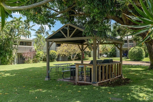 view of property's community with a gazebo and a yard