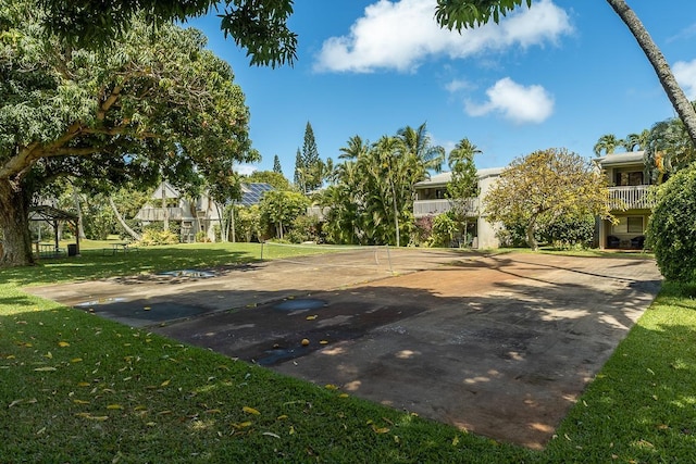 view of basketball court featuring a lawn