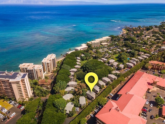 birds eye view of property with a water view and a view of city