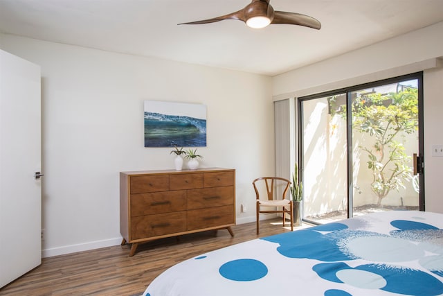 bedroom featuring ceiling fan and dark wood-type flooring