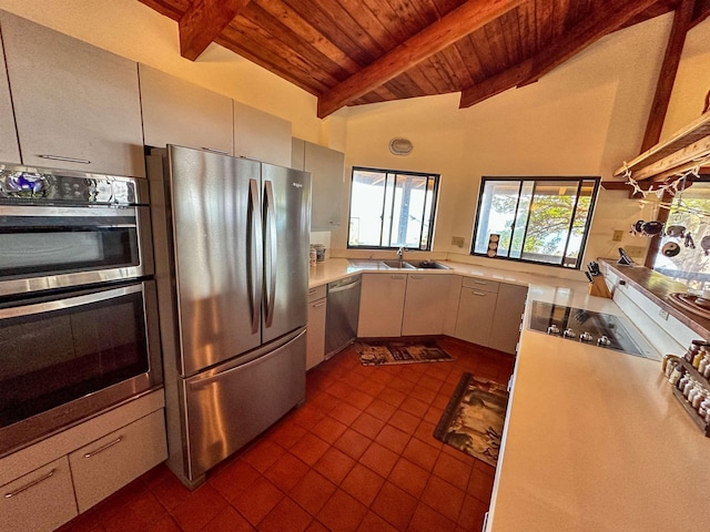 kitchen with appliances with stainless steel finishes, wood ceiling, sink, high vaulted ceiling, and beam ceiling