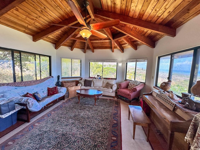carpeted living room with lofted ceiling with beams, ceiling fan, and wood ceiling