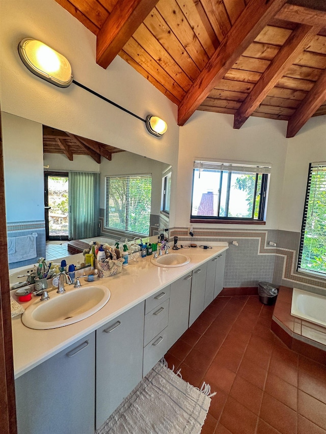 bathroom featuring tile patterned flooring, tile walls, beamed ceiling, and wooden ceiling