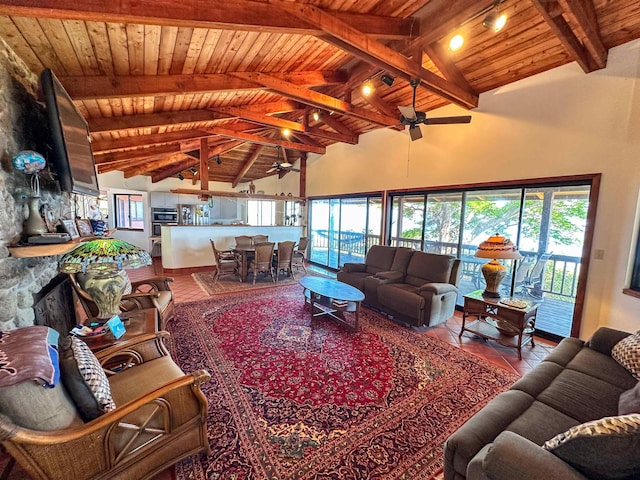 tiled living room with ceiling fan, beam ceiling, wood ceiling, and high vaulted ceiling