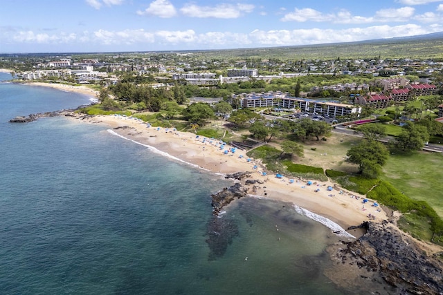 drone / aerial view featuring a view of the beach and a water view