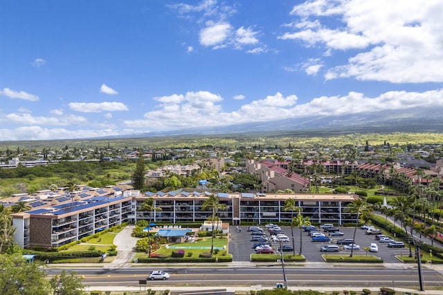 birds eye view of property with a mountain view