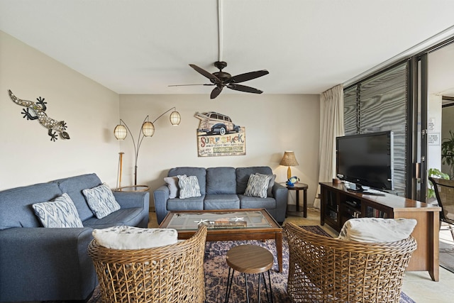 living area with a ceiling fan