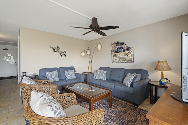 living area featuring ceiling fan and tile patterned floors