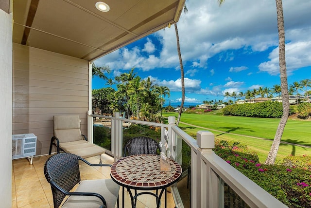 155 Wailea Ike Pl Unit 67, Kihei, HI 96753 - balcony with an AC wall unit and view of golf course