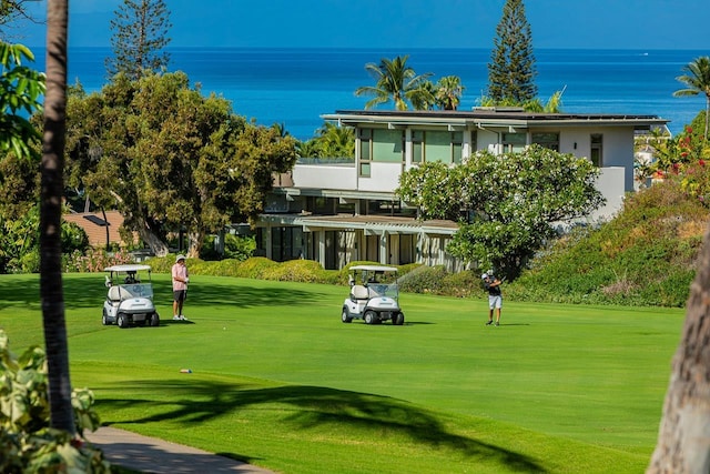 155 Wailea Ike Pl Unit 67, Kihei, HI 96753 - view of home's community with a water view, a yard, and view of golf course