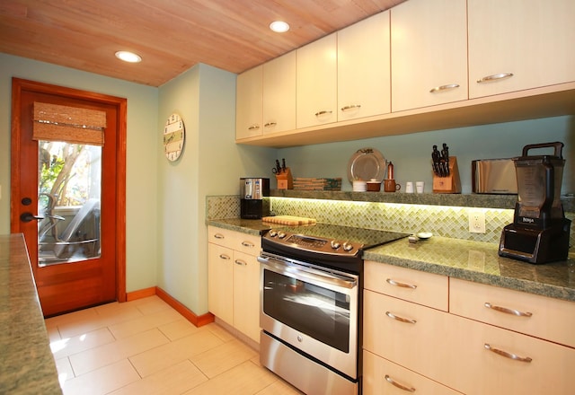 kitchen with white cabinets, light tile flooring, stainless steel electric range, and wood ceiling