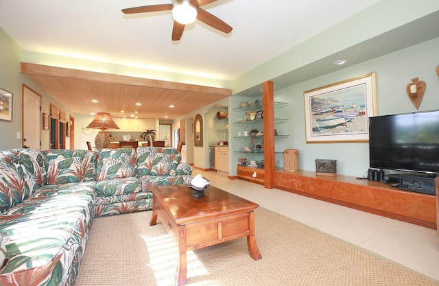 living room featuring ceiling fan and tile floors