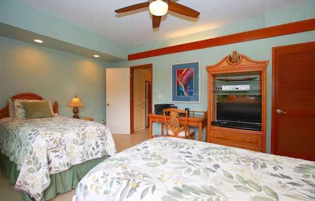 bedroom featuring ceiling fan, stainless steel fridge, and hardwood / wood-style flooring