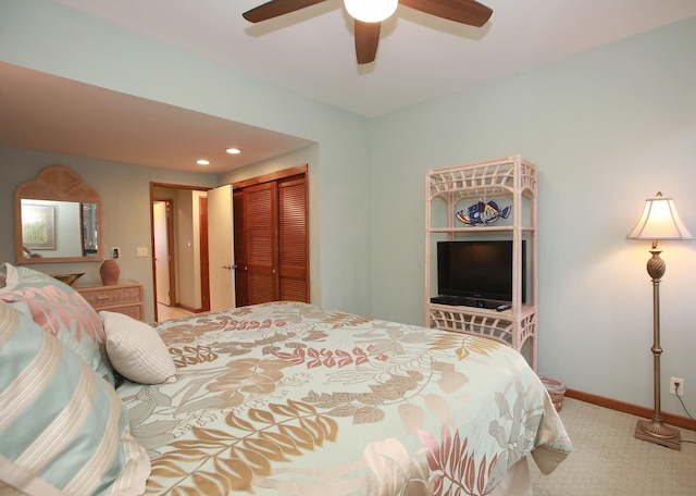 carpeted bedroom with a closet and ceiling fan