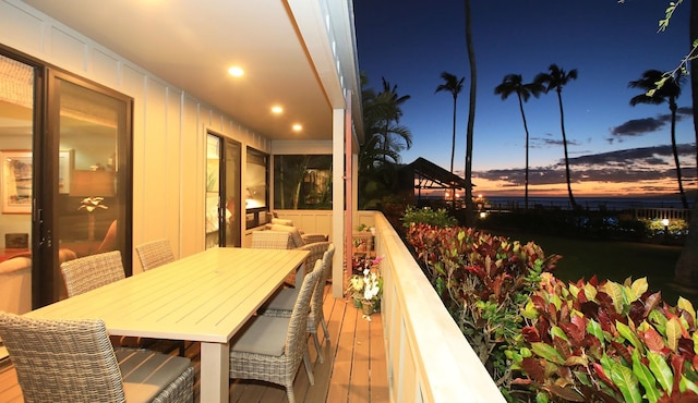 view of balcony at dusk