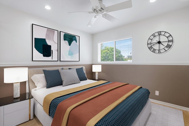 bedroom featuring ceiling fan and light hardwood / wood-style flooring