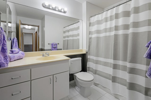 bathroom with tile patterned flooring, toilet, a shower with shower curtain, and vanity