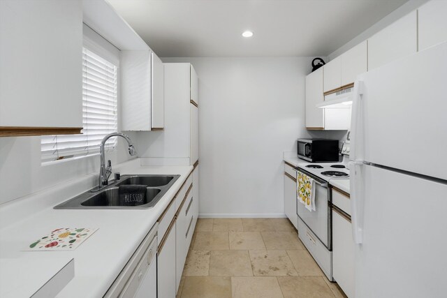 kitchen featuring premium range hood, sink, white cabinets, light tile patterned floors, and white appliances