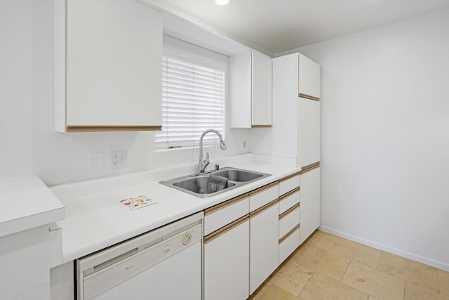 kitchen featuring sink, light tile patterned flooring, white cabinetry, and dishwasher