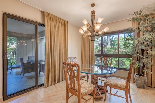 dining area featuring a notable chandelier