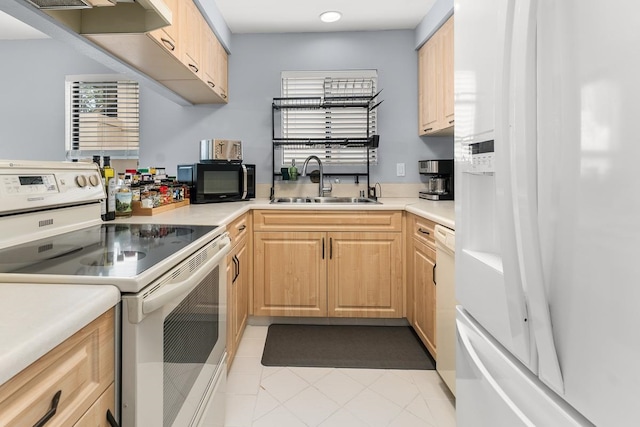 kitchen with sink, light brown cabinets, white appliances, and light tile patterned floors