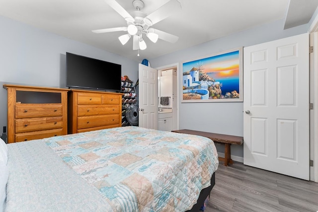 bedroom with ceiling fan and hardwood / wood-style floors