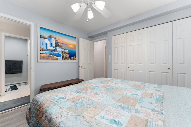 bedroom with ceiling fan and a closet