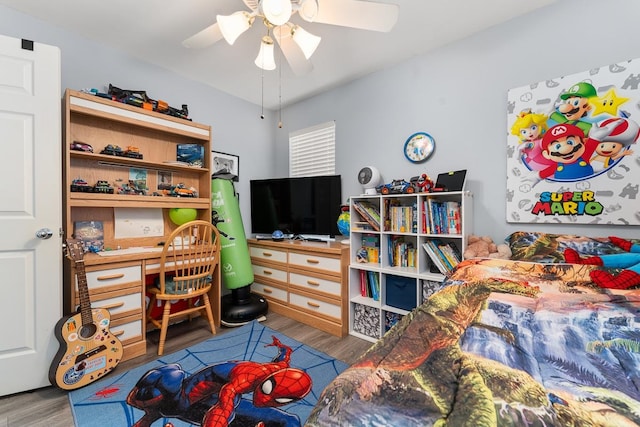 bedroom featuring ceiling fan and hardwood / wood-style flooring