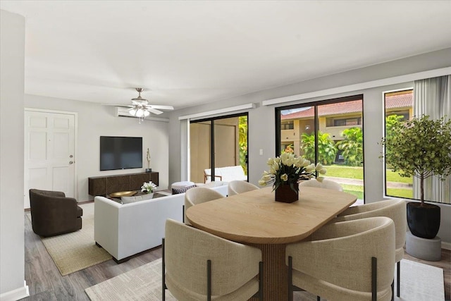 dining area featuring ceiling fan and light wood-type flooring